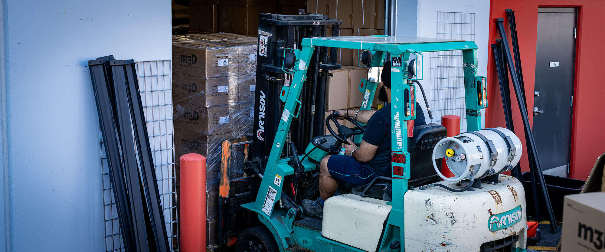 Matter3D employee moving a pallet of 3D printing filament with a forklift at Canada’s largest filament factory in Victoria, BC.